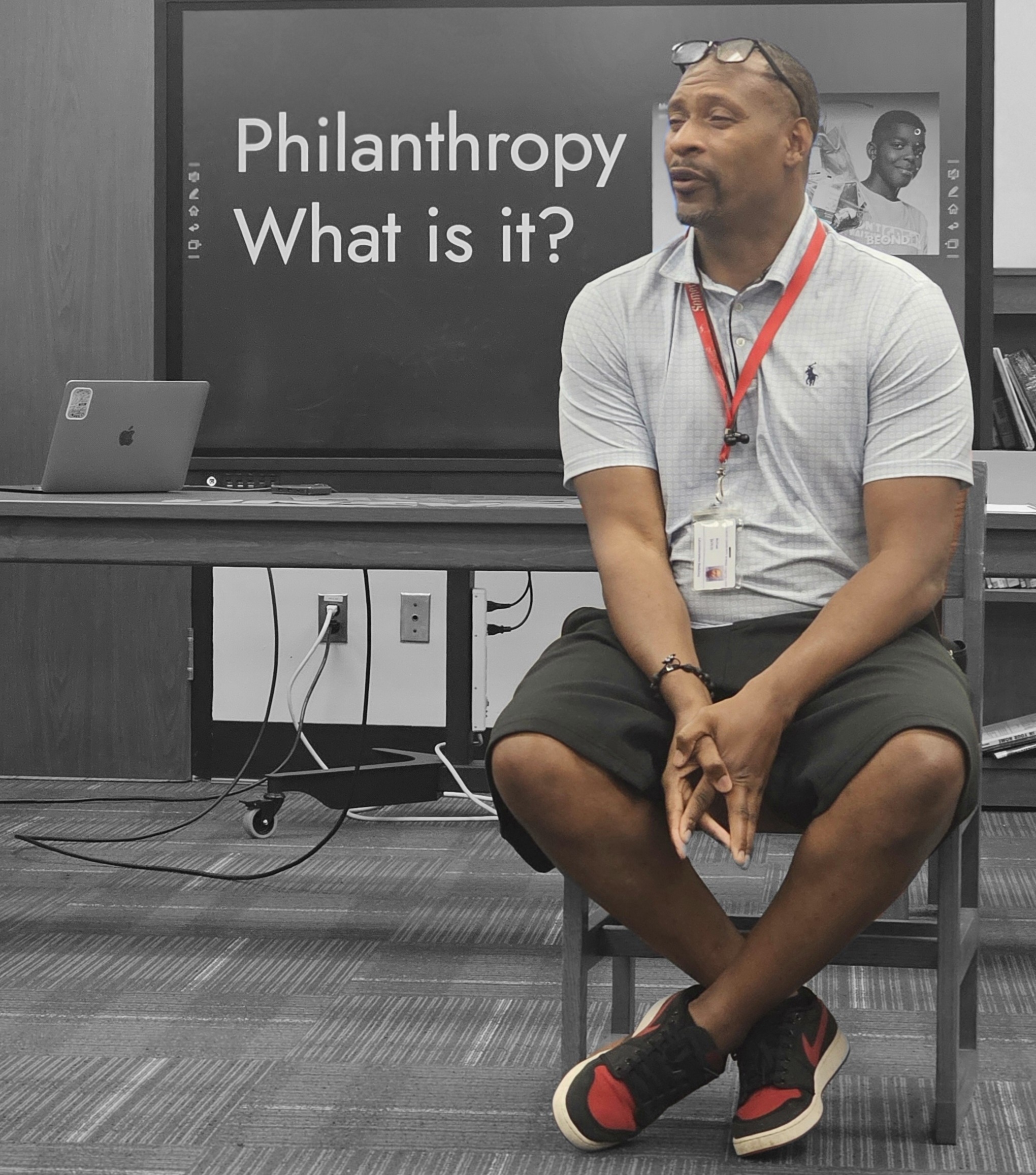 Guest speaker or coach interacting with kids
